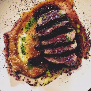 Duck breast with apricot sauce and blueberries